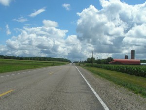 wisconsin blue skies, puffy clouds, sunny day, corn fields and a red barn