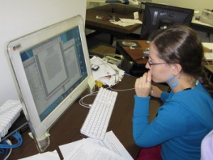 me, at a desk, in the lab, working on documentation at a computer